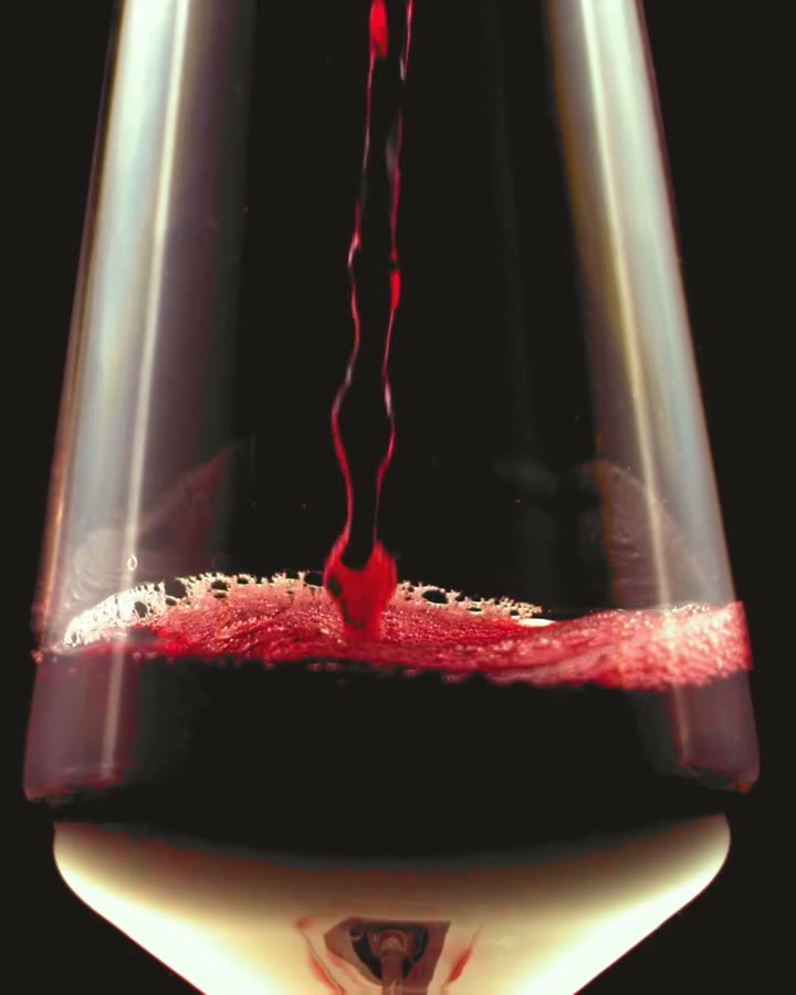 A glass filled with red wine
